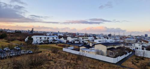 an aerial view of a city with white houses at City view, bright & cozy - Free parking (A4) in Reykjavík