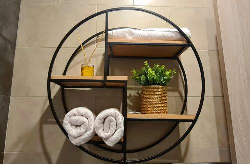 a round towel rack in a bathroom with towels at Nature View Designer Studio in Tsaghkadzor