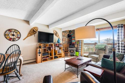 a living room with a couch and a table at 2 Bed 1 Bath Apartment in Wildernest, CO in Silverthorne