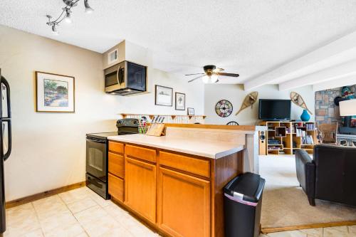 a kitchen with orange cabinets and a counter top at 2 Bed 1 Bath Apartment in Wildernest, CO in Silverthorne