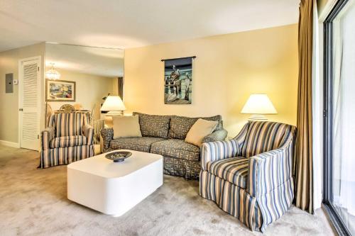 a living room with a couch and two chairs at Niceville Condo with Pool Access Less Than 8 Mi to Destin! in Niceville