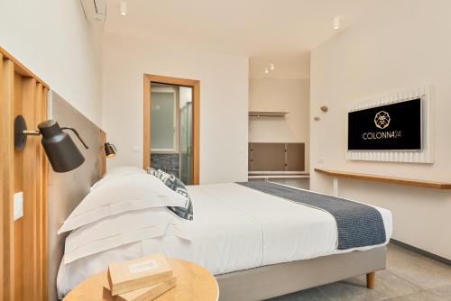 Ένα ή περισσότερα κρεβάτια σε δωμάτιο στο Colonna 24 Luxury Room in Portovenere near 5 Terre
