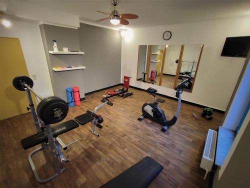 a gym with several exercise bikes in a room at Best Western Parkhotel Brehna-Halle in Brehna