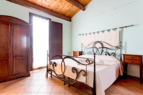 Tempat tidur dalam kamar di Sa Domo De Alene