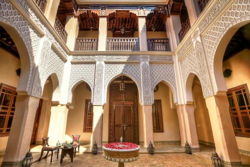 a large building with a large clock on the front of it at Riad Kniza in Marrakech