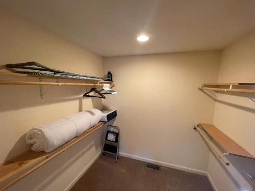 a room with a hallway with shelves on the wall at Entire Private 2 bedrooms house, nice neighborhood in Arnold
