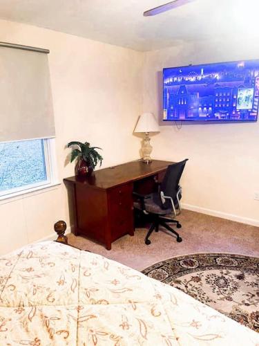a bedroom with a desk and a computer in it at Entire Private 2 bedrooms house, nice neighborhood in Arnold