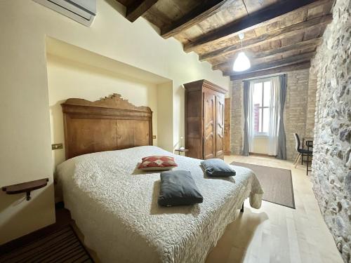 En eller flere senge i et værelse på Casa Collini Salò