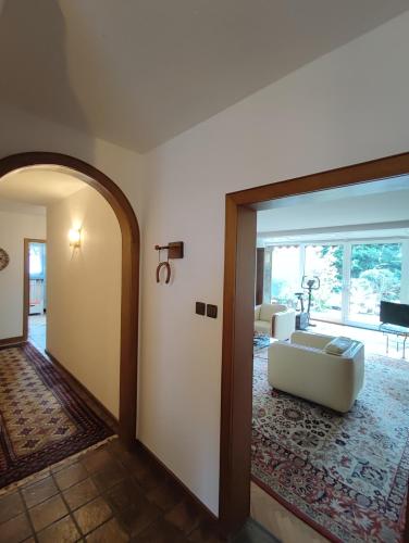 a living room with a couch in the middle of a room at Spacious for 5 - kitchen - House - Wifi in Nordhorn