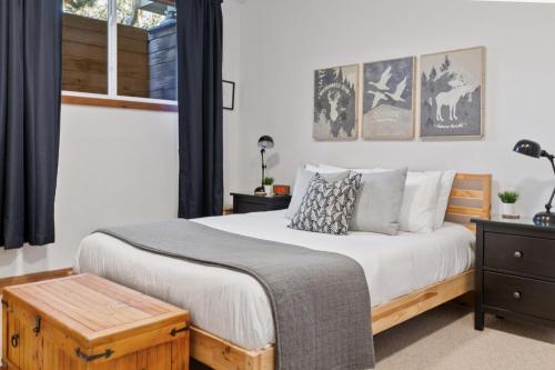 a bedroom with a large bed and a window at The Parker House Gorgeous Light and Spacious Chalet 86100 in Blue Mountains