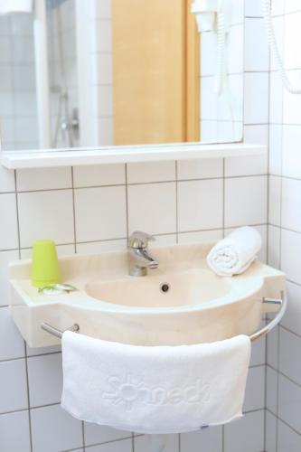 a bathroom with a sink and a mirror at Residence Sonneck in Martello