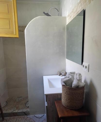 a bathroom with a white sink and a mirror at Casas Rurales Villa Sargento in Níjar