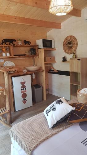 a room with a bed in a wooden room at La lyalis in Aiguines