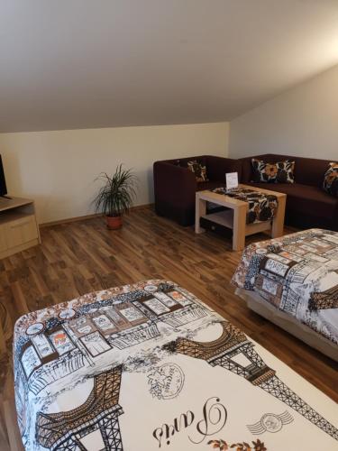 a living room with a bed and a couch at Guest rooms Bansko in Bansko