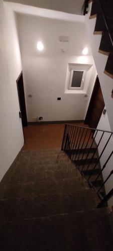 a staircase in a building with a stair case at DIMORA AL SARACENO in Ferrara