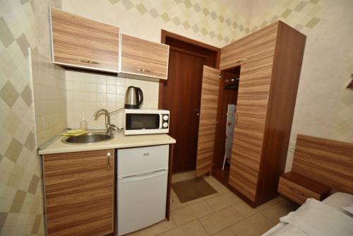 Una cocina o zona de cocina en Malon Apartments