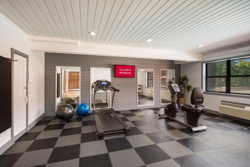 a gym with treadmills and exercise equipment in a room at Red Roof Inn & Suites Lexington - Hamburg in Lexington