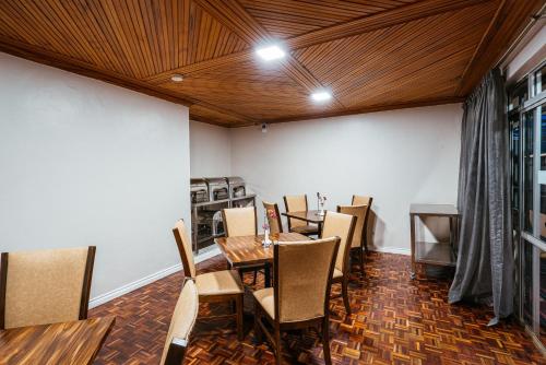 a dining room with a table and chairs at Cozy Stead in Nairobi