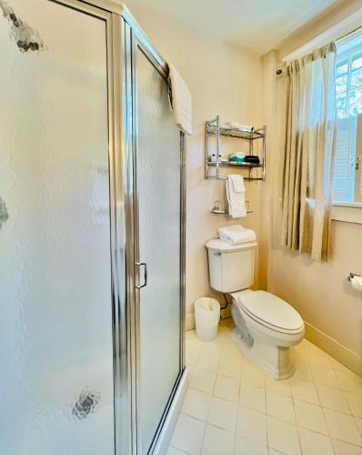 a bathroom with a shower and a toilet at Gateways Inn in Lenox