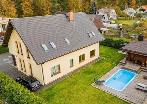 an aerial view of a house with a swimming pool at Amber Villa in Rīga