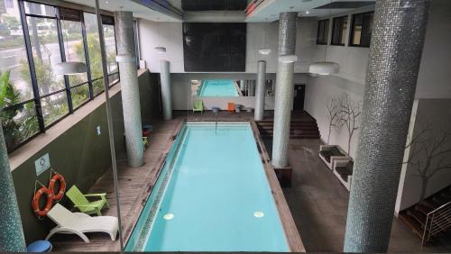 an overhead view of a swimming pool in a building at Urban Park Apartment in Durban