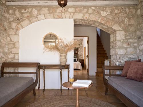 a living room with a couch and a table at Orfos Villas in Agios Nikolaos