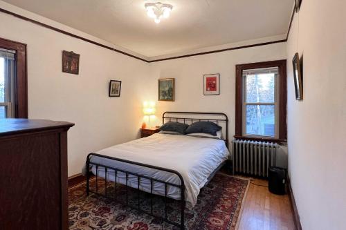 a bedroom with a bed and a window at Chic Milwaukee Apartment in Hip Neighborhood! in Milwaukee