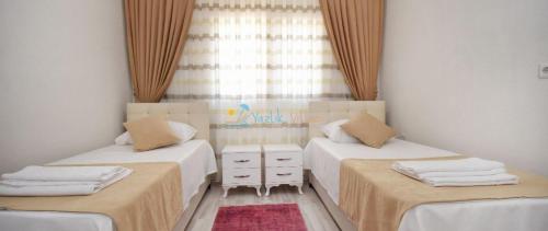 Postel nebo postele na pokoji v ubytování villa kaan