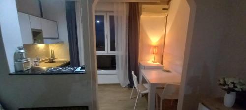 a kitchen with two sinks and a table in a room at Vidikovac 2 in Belgrade