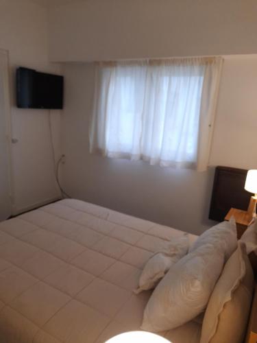 Una cama o camas en una habitación de Apartamento Esmeralda
