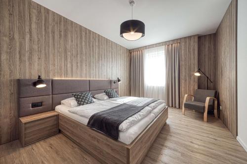 Ένα ή περισσότερα κρεβάτια σε δωμάτιο στο Trio Tatry Superior