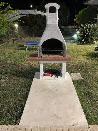 a pizza oven sitting in a park at night at Villa Lidia & Attico degli artisti, free pets , giardino recintato e attrezzato in Minturno