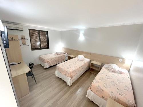 Katil atau katil-katil dalam bilik di Hotel Ijuí