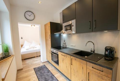 a kitchen with a sink and a counter top at W-Spirit Apartments in Jerzens