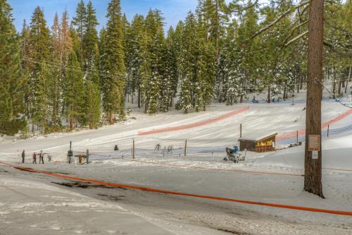 a snow covered ski slope with people on it at Granlibakken Getaway - #72A in Tahoe City