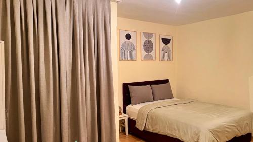 a bedroom with a bed and a window with curtains at Akaretler spacious family suitable 6 person flat in Istanbul