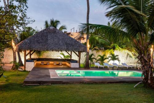 a resort with a pool and a gazebo at Barra Grande Beach Club in Barra Grande