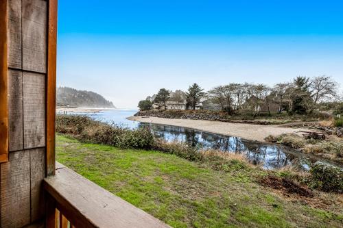 a view of the water from a porch of a house at Sandy Landing in Neskowin