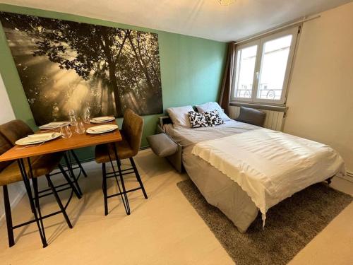 Кровать или кровати в номере Sélestat centre - Le classique - 5 personnes