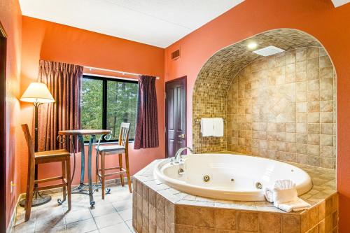 a large bathroom with a tub and a table at Chula Vista Condo 2251 in Wisconsin Dells