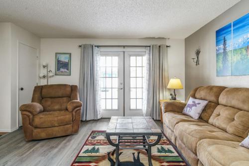 a living room with a couch and a chair at The Moose Crossing in Anchorage