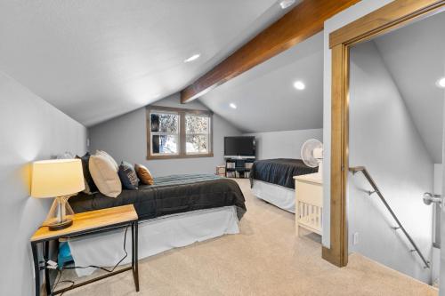 a bedroom with two beds in a attic at Antoine Cabin in Chelan