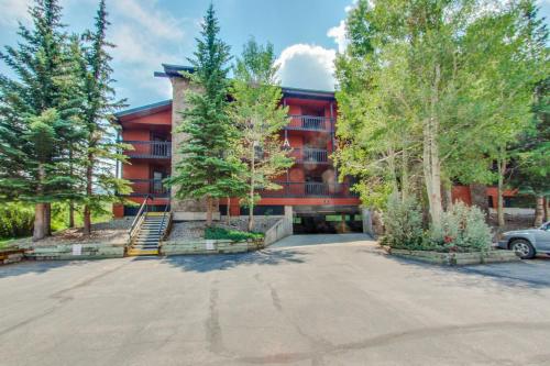 a large red building with trees in front of it at Mountainside Retreat in Frisco