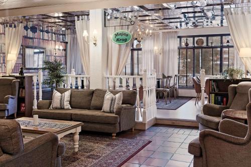 a living room with couches and chairs in a store at Best Western Rådmannen in Alvesta