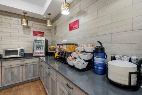 a fast food restaurant with a counter with food at Best Western Plus Rumford Falls in Rumford