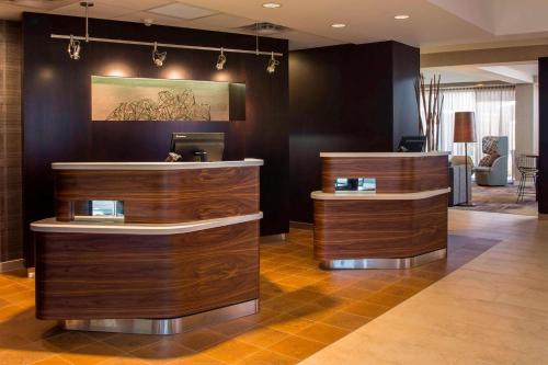a salon with two wooden counters in a room at Sonesta Select Atlanta Norcross I 85 in Norcross
