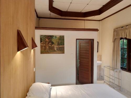 Postel nebo postele na pokoji v ubytování WAH TEJA HOMESTAY