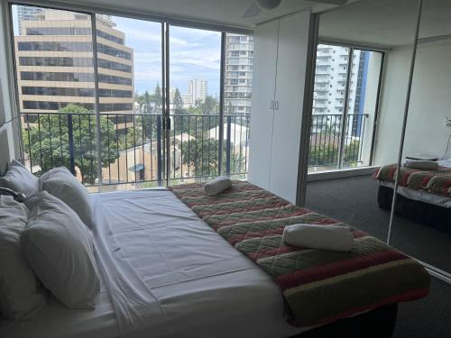 a hotel room with a bed and a window at Condor Ocean View Apartments Surfers Paradise in Gold Coast