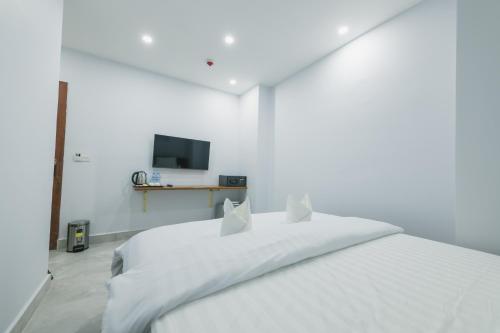Ένα ή περισσότερα κρεβάτια σε δωμάτιο στο Residence 110 (Hotel and Apartments)