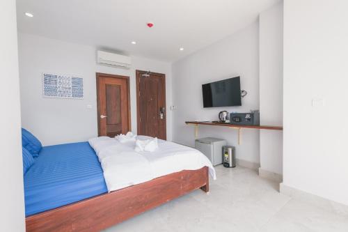 Ένα ή περισσότερα κρεβάτια σε δωμάτιο στο Residence 110 (Hotel and Apartments)